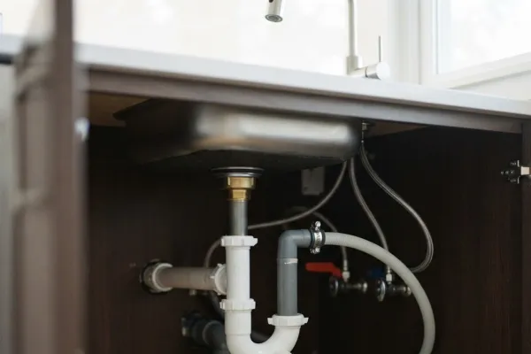 Monthly maintenance tasks for under-sink plumbing system